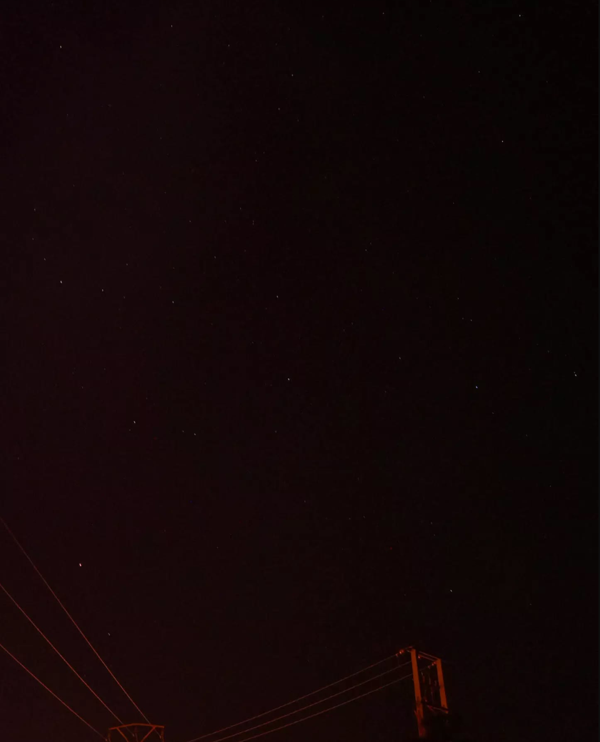 night sky, stars and a light pole